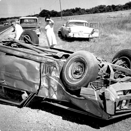 Black & white photo of the 1969 Okahoma car accident involving IDShield founder, Harland Stonecipher.