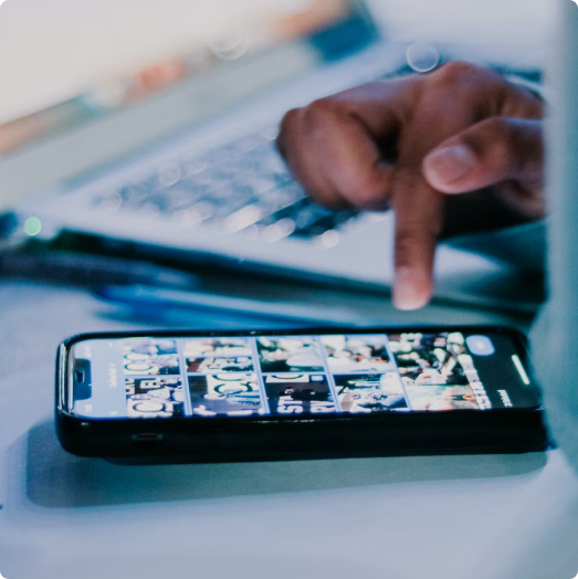 Person reviewing social media images on their cellphone.